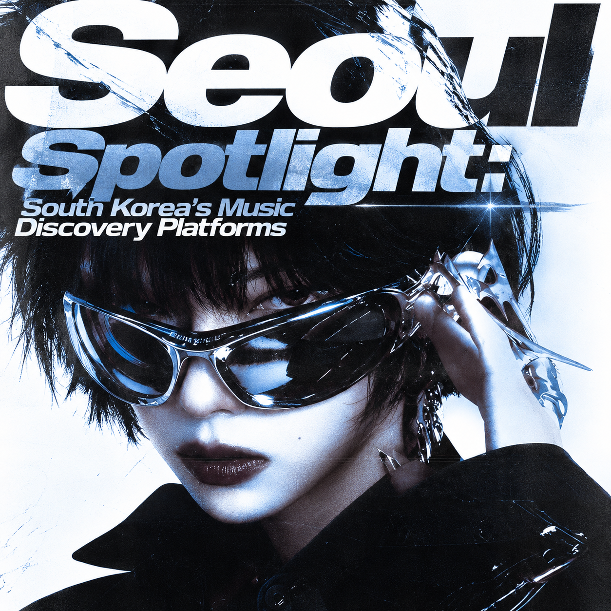 Seoul Spotlight cover with a musician in silver sunglasses and bold white lettering.